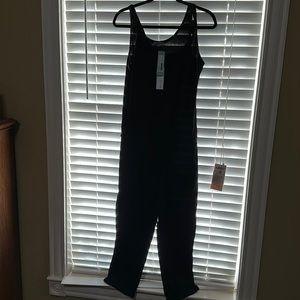NWT Black Michael tank jumpsuit with drawstring waist.